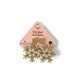 Snowflake-shaped earrings on a pink card with 'Soulstacks' branding.