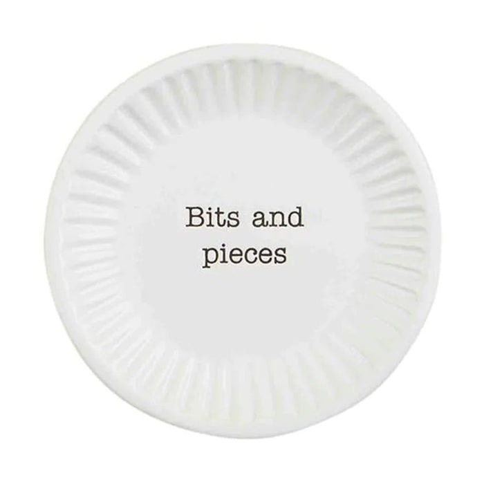 Mud Pie Bits and Pieces Plate featuring white ceramic with fluted edges and “Bits and pieces” text in black font.