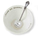Mud Pie “Just In Queso” Dip Bowl and Ladle Set featuring a white ceramic bowl with black lettering and a silver ladle stamped “So Cheesy.”