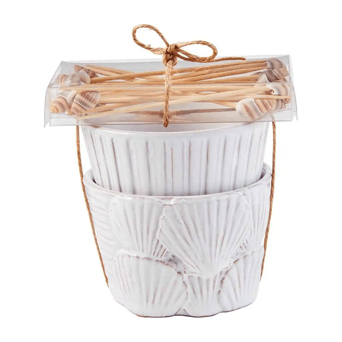 Mud Pie Fan Shell Ramekin Set featuring white ceramic shell-embossed bowls and bamboo shell-topped picks tied with jute.