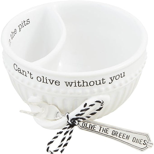Mud Pie Olive Tidbit Set featuring white divided ceramic bowl with “Can’t olive without you” and “In the pits” text, paired with a silverplate fork labeled “Olive the green ones.”