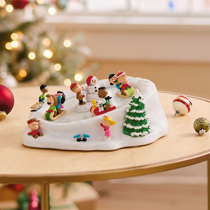 https://annieshallmark.com/cdn/shop/products/hallmark-peanuts-gang-sledding-musical-tabletop-figurine-with-motion-929154_700x700.jpg?v=1699576693