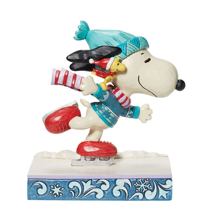 https://annieshallmark.com/cdn/shop/products/jim-shore-peanuts-snoopy-woodstock-ice-skating-figurine-62-407506_700x700.jpg?v=1697862649